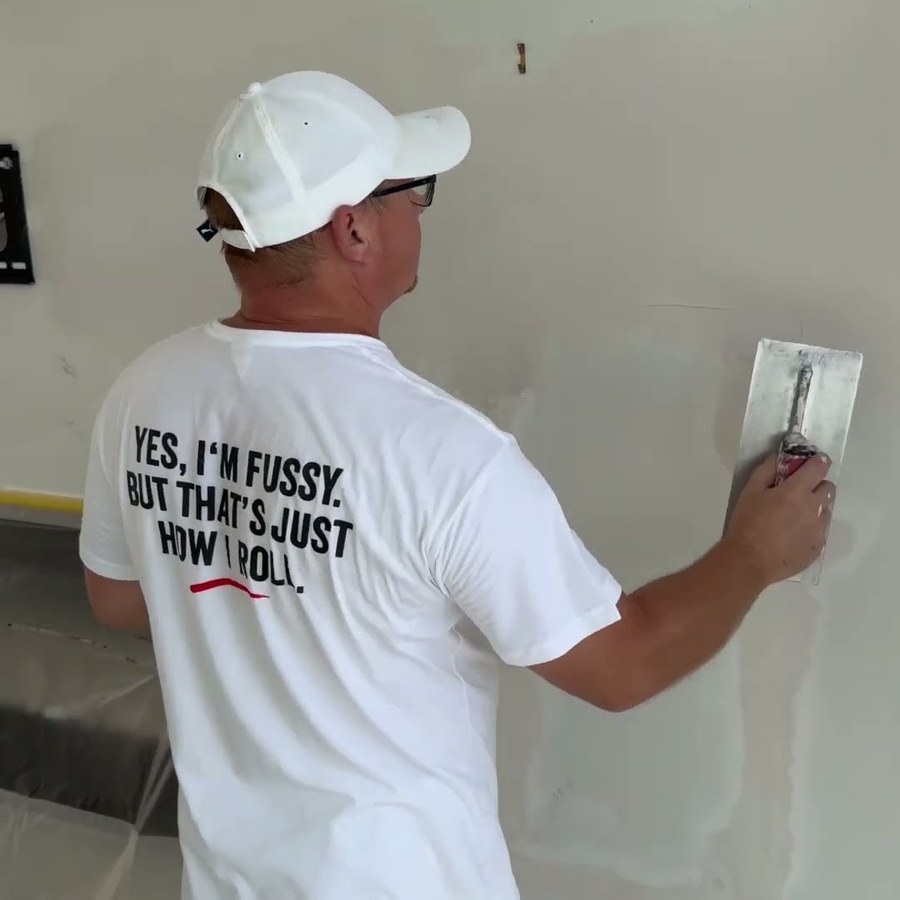 Easy Flow Plus being spread on plasterboard with a trowel